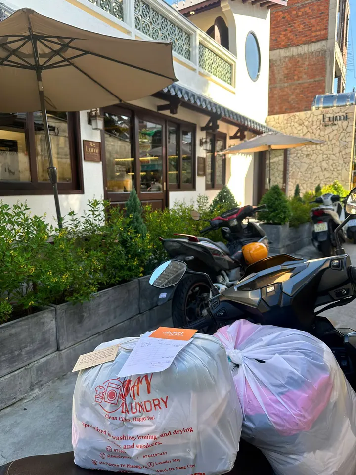 Two sealed and labelled May Laundry bags at Lumi Hoi An