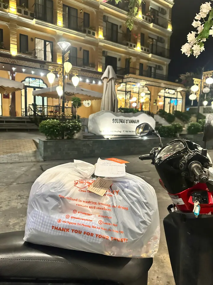 Night-time laundry delivery outside Soluna D'Annam hotel in Hoi An